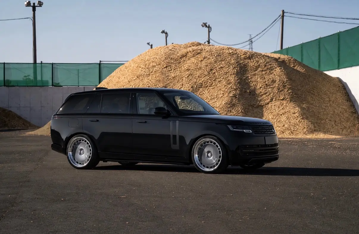 Black Range Rover with custom chrome-lipped alloy wheels