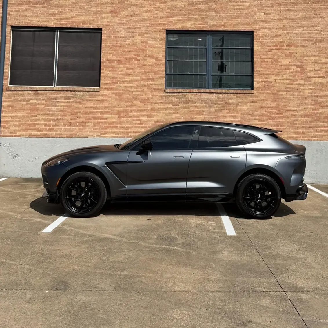 Gray luxury vehicle parked outside